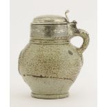 A Rhenish stoneware tigerware salt-glazed Tankard,17th century, the globular body moulded with an