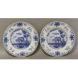 A pair of delft blue and white Plates,mid 18th century, decorated with sheep in a naturalistic