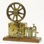 An unusual twin coil electric and clockwork ticker tape machine,late 19th century, the wooden