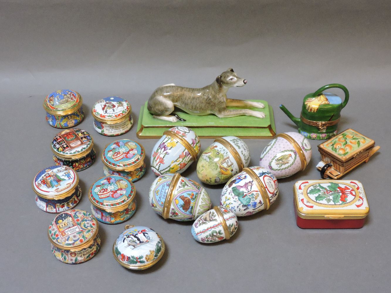 ##Fifteen Halcyon Days enamel boxes, a porcelain greyhound, and two Limoges enamel boxes in the form