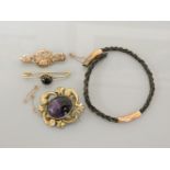 A Victorian cabochon amethyst brooch, a 9ct gold bar brooch, a banded cabochon agate bar brooch, and