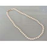 A single row of uniform cultured pearls, with an 18ct gold clasp set with diamonds