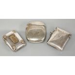 Two sterling silver vesta cases, and a white metal vesta case with applied crest