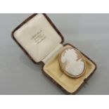 A carved shell cameo brooch, in a gold mount, tested as approximately 15ct gold