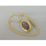 An 18ct gold opal triplet brooch/pendant, on an 18ct gold chain, 12.7g