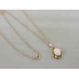 A 9ct gold single stone opal cabochon pendant, on a chain, 3.0g