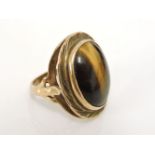 A 9ct gold tiger's eye cabochon ring, 8.7g