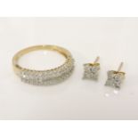 A 9ct gold diamond half eternity ring, and a pair of diamond cluster earrings stamped 9k to base,