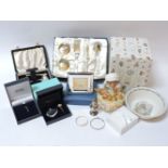 A Tiffany & Co spirit flask, silver christening bracelet, photo frame, Peter Rabbit china, and a