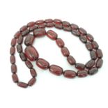 A single row graduated barrel shaped bakelite bead necklace, 108.3g