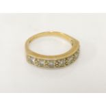 An 18ct gold seven stone diamond half eternity ring, 3.39g