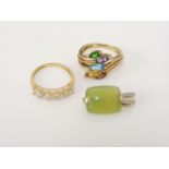 An 18ct gold five stone cubic zirconia ring, a 9ct gold assorted gemstone spray ring, and a 9ct gold