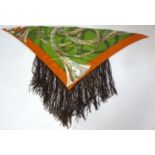 An Hermès silk scarf, with brown leather tassel trim, designed by T de Linares, a green ground