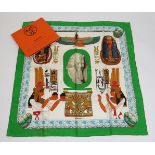 An Hermès silk scarf, 'Rames', designed by Rybal, green border with an Egyptian printed design