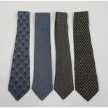 Three Hermès silk ties, in blue tones, and a Versace silk tie, navy with 'GV' monogrammed design (