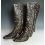 A pair of EL Vaquero brown python skin cowgirl boots, with cream stitching detail to seams, gold