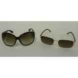 A pair of Burberry sunglasses,green tinted lenses with Haymarket check/tortoiseshell print to