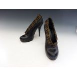 A pair of Fendi ankle boots,black leather with woven 'F' monogrammed fabric trim,Size 38 (2)