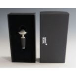 A Mont Blanc wine stopper, brushed steel, monogrammed 'Mont Blanc' in box with service guide