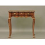 A reproduction George III style walnut shaped front side table, 77cm wide