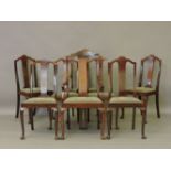 A set of eight Edwardian mahogany and line inlaid dining chairs, including a pair of elbow chairs