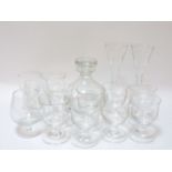 A set of ten Dartington glass goblets, a decanter, and two champagne flutes
