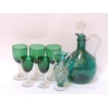 A Georgian green glass decanter and glasses