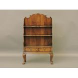 A reproduction George III style walnut waterfall bookcase, 61cm wide