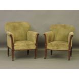 A pair of Edwardian ladies and gentleman's Adam style overstuffed upholstered chairs, the largest