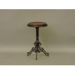 A Victorian cast iron revolving top stool, 32cm diameter