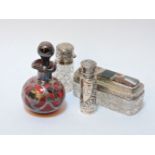 A small cut glass and hardstone mounted box, and three silver and silver mounted scent bottles