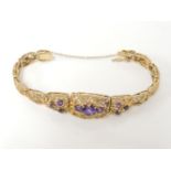 A 9ct gold amethyst plaque bracelet, with graduated articulated plaques, 24.9g