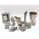 Silver items, including an inkwell, rose vase, cream jug, strainer, a silver plated cup, etc