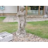 A composite garden statue of semi clad maiden, 104cm high, and a composite stone statue of a bathing