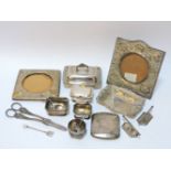 Small silver items, including a three piece cruet, pierced basket, two silver frames, silver