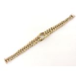 A 9ct gold graduated curb link bracelet, with textured link centrepiece, 31.6g