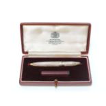 A sterling silver propelling pencil, by S J Rose, with barley engine turned finish, retailed by