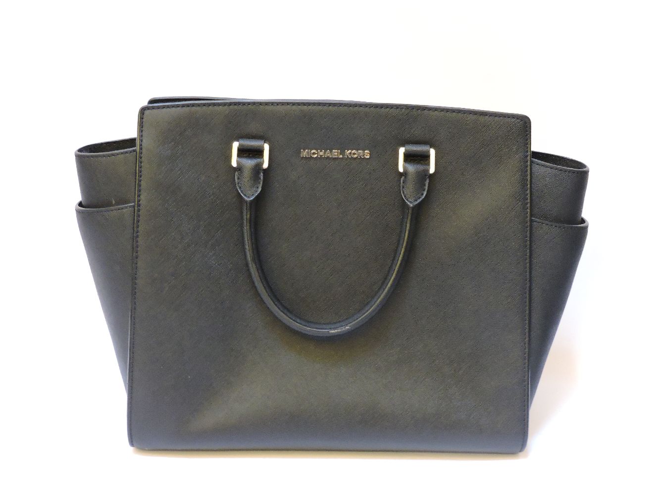 A Michael Kors Selma large black tote handbag, in Saffiano leather, gold tone hardware, date code