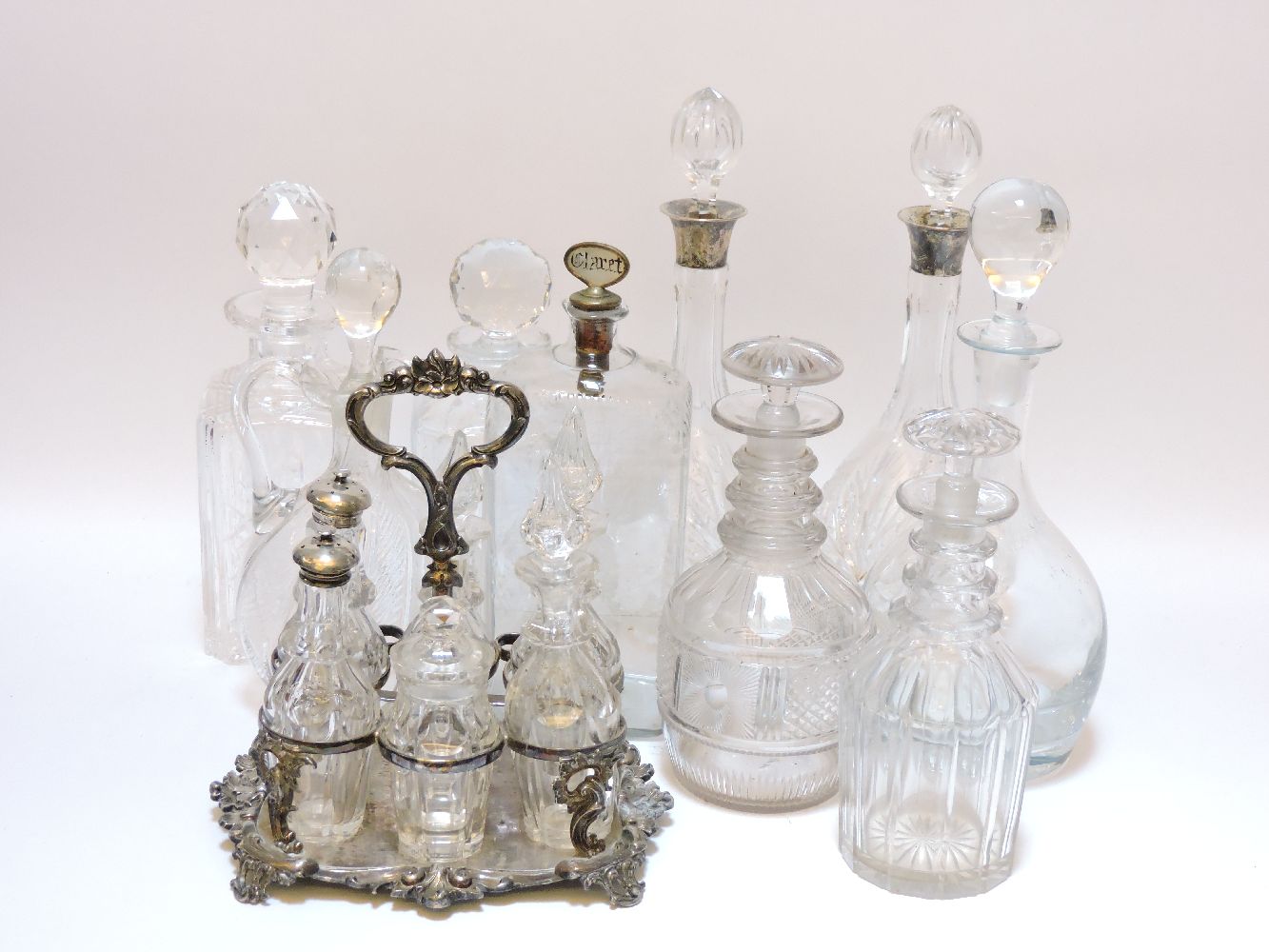A Victorian lead glass decanter, a pair of silver mounted cut glass decanters, six other glass