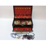 A jewellery box and contents, including brooches and beads