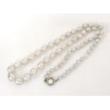 A single row graduated cultured pearl necklace, with silver paste stone and cultured pearl clasp