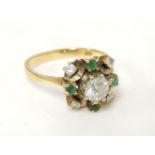 An 18ct gold diamond and emerald cluster ring, with original H Samuel certificate and receipt