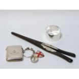 A silver vesta case, a crested silver napkin ring, and ebony glove stretchers