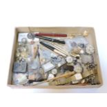 A box of items, including ten wristwatches, silver vesta case, a pair of silver knife rests, etc