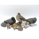 Eight ceramic figures, by Karen Fawcett, comprising a thrush, a starling, a blackbird, a robin, a