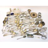 A large assortment of silver items, to include napkin ring, spoons, teaspoons, clips, etc