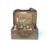 An Edwardian crocodile skin dressing case, with silver mounted fittings, by Walker and Hall,