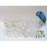 A collection of mixed glassware, miniature glass animals, and a Murano glass parrot