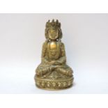 A polished bronze figure of a Bodhisattva, seated on a lotus base, 14cm high