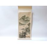 A modern Chinese scroll, depicting a fisherman in a wooded landscape